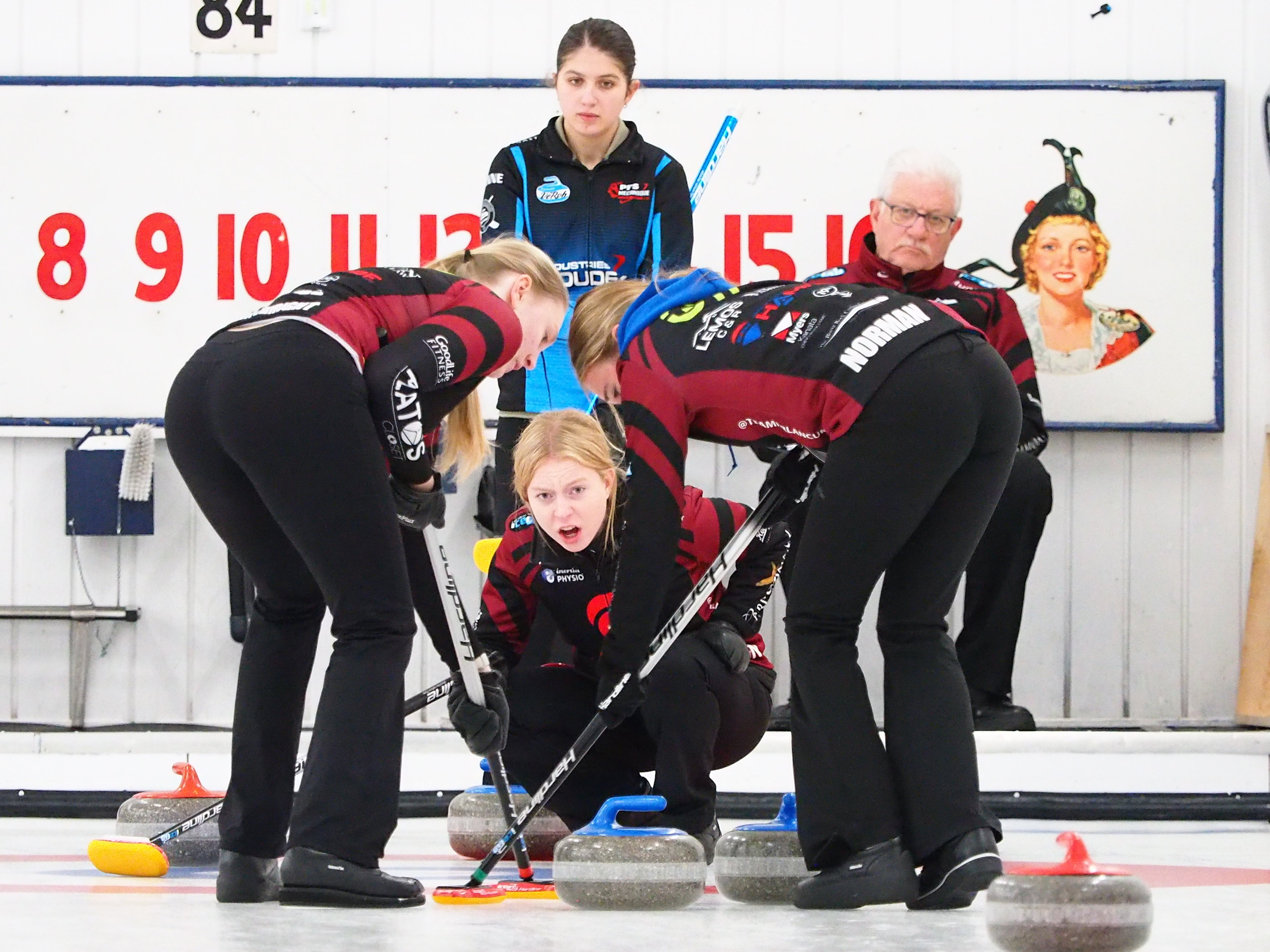 Junior women's team delivering a stone